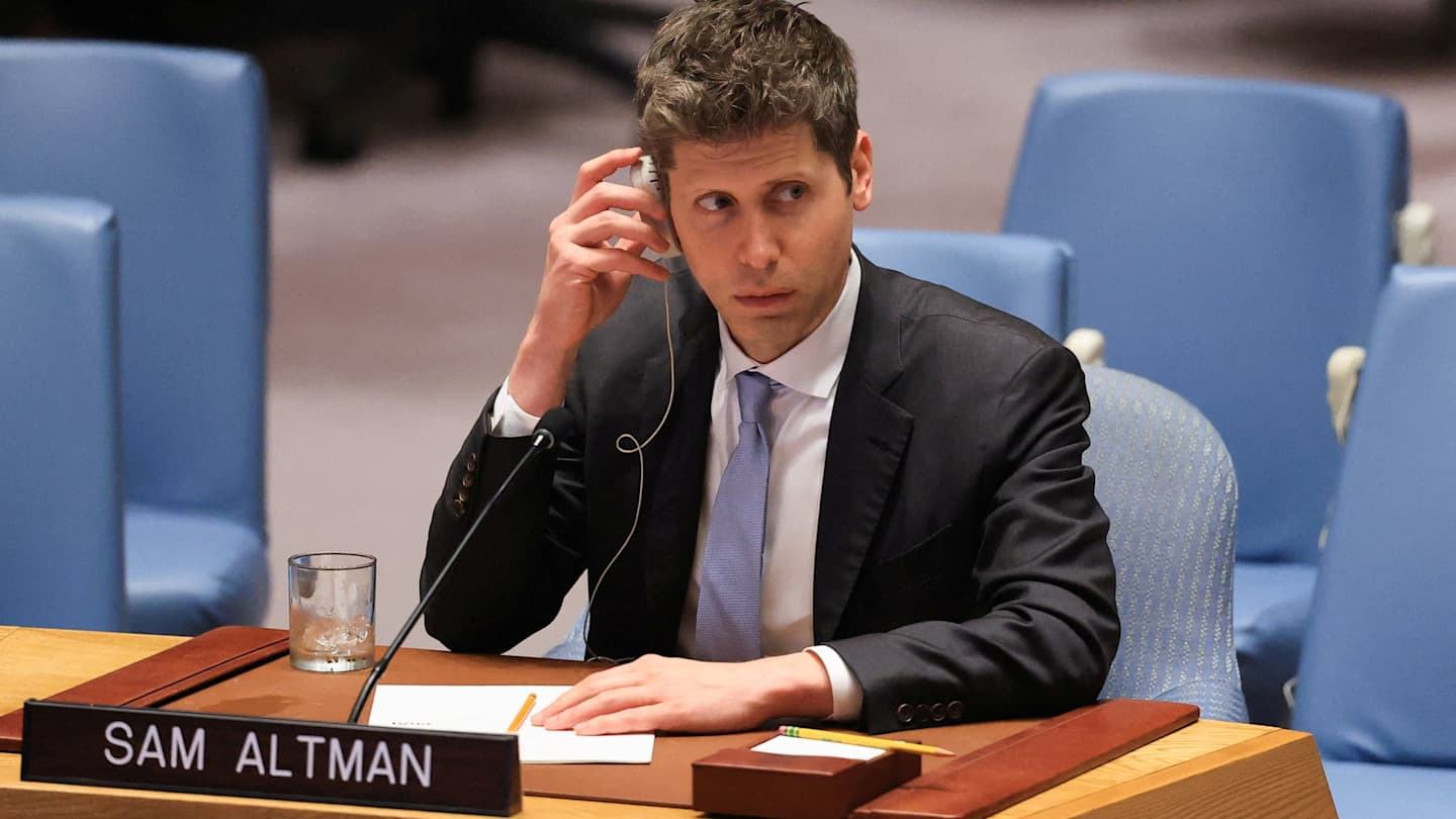 Sam Altman listens with an earpiece at a United Nations Security Council session, seated at a desk with his nameplate.
